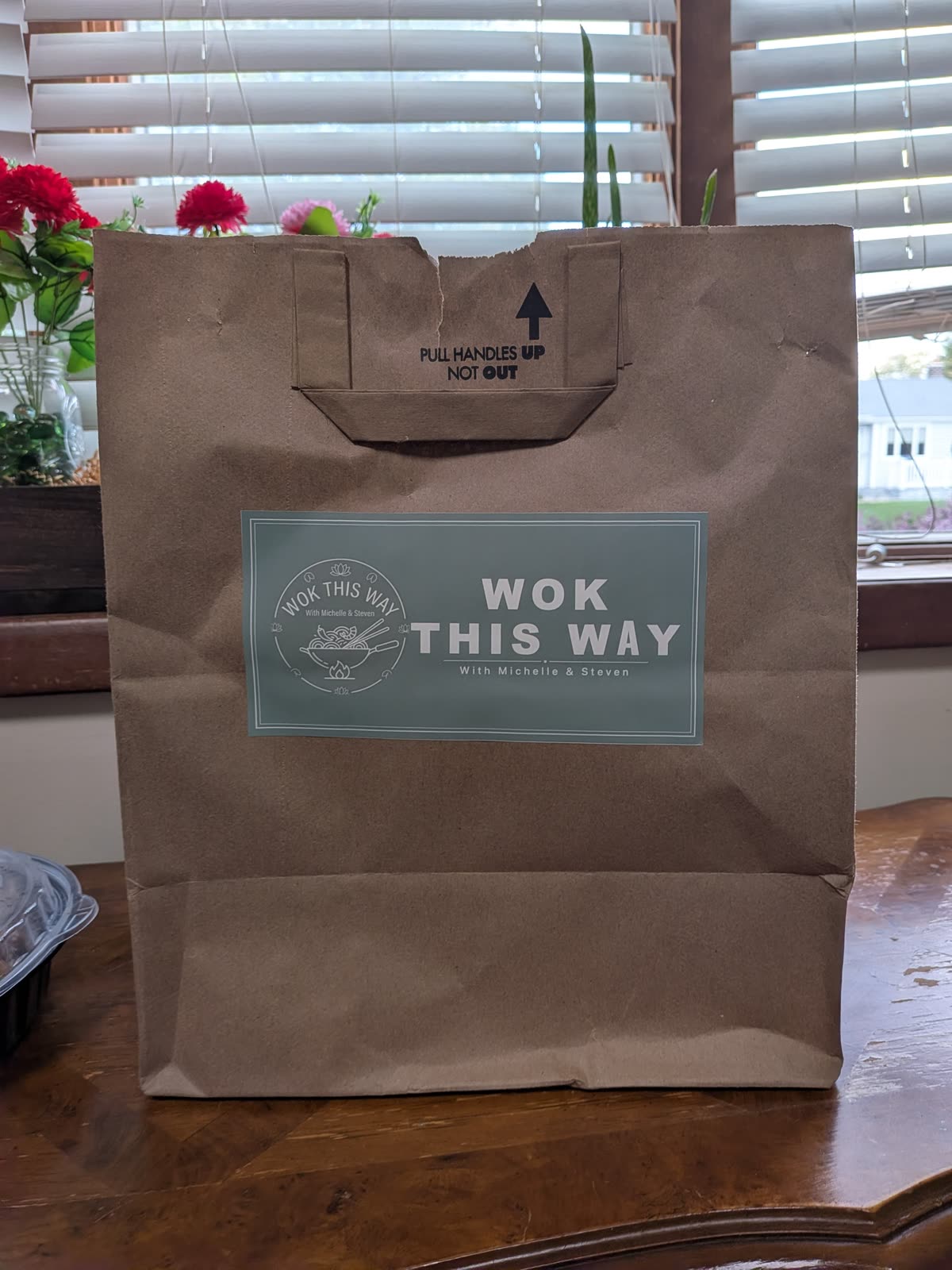 Kohl's bag transformed into a takeout bag with the Wok This Way sticker